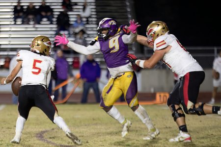 Tigers to take on Central Valley Christian Friday in Div. II championship game after big win over Centennial Lemoore's Trevon Gaffney breaks through the line and gets a key sack.